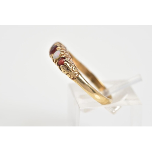 45 - A 9CT GOLD RING, designed as a row of three circular cut garnets interspaced by two circular opals a... 