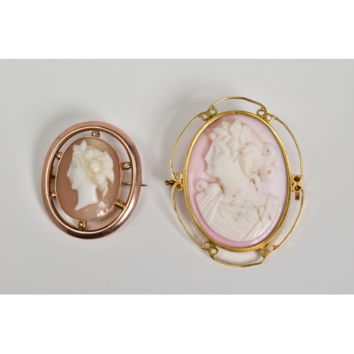 54 - TWO CAMEO BROOCHES, the first of oval design depicting a lady in profile within a scrolling detail m... 