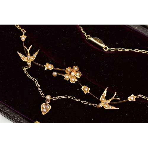 1 - A GOLD EDWARDIAN SPLIT PEARL NECKLACE, formed of swallows and floral detail between blade bar sectio... 