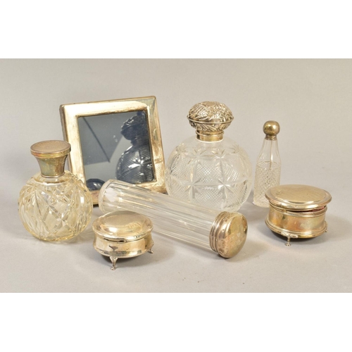 103 - A GROUP OF DRESSING TABLE SILVER, including two spherical cut glass scent bottles with silver pull o... 