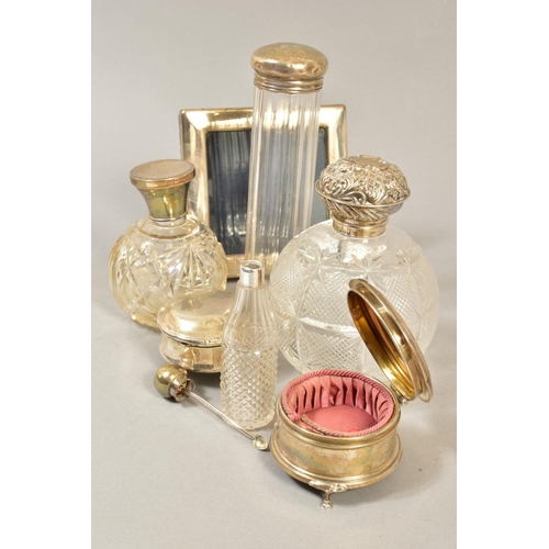 103 - A GROUP OF DRESSING TABLE SILVER, including two spherical cut glass scent bottles with silver pull o... 