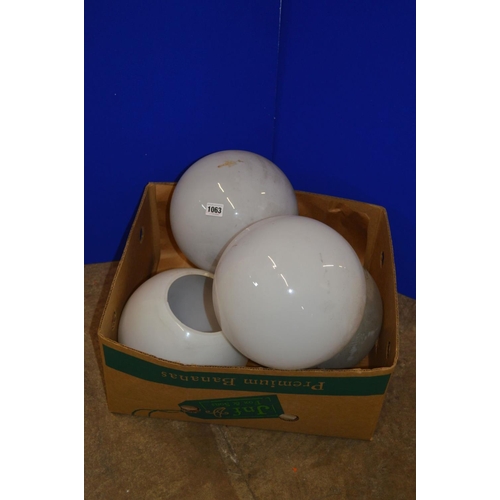 1063 - A BOX CONTAINING FOUR OPAQUE WHITE GLASS SPHERICAL CEILING LIGHT FITTINGS, approximate diameter 30cm... 