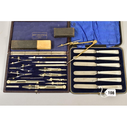 108 - A CASED SET OF SIX EDWARDIAN SILVER HANDLED TEA KNIVES, shell embossed handles, Sheffield 1906, toge... 