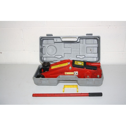 1101 - A CASED MARKSMAN 2 TONNE TROLLEY JACK with detached carrying handle and bar