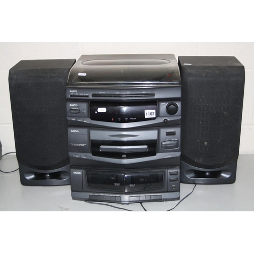 1102 - A SANYO HI FI with FM radio, CD, dual tape deck and two speakers (PAT pass, radio and CD working, ta... 