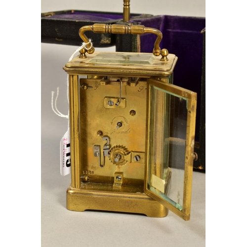 115 - A LATE VICTORIAN BRASS CASED CARRIAGE CLOCK, white enamel dial cracked upper left, with key and carr... 