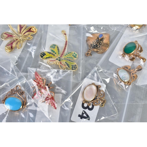 124 - A SELECTION OF JEWELLERY, to include four yellow metal brooches in forms such as butterflies and dra... 