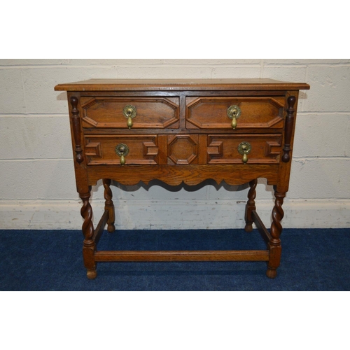 1314 - AN EARLY 20TH CENTURY OAK SIDE TABLE, four assorted geometric fronted drawers on barley twist legs u... 