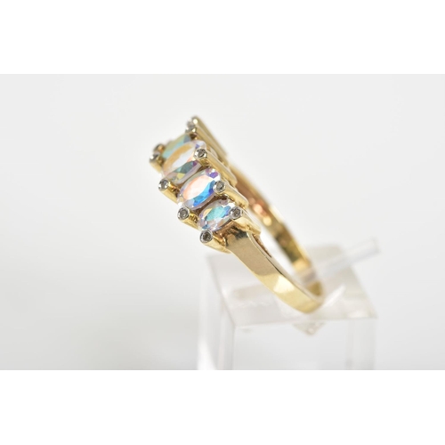 140 - A 9CT GOLD FIVE STONE RING, designed with five graduated oval cut mystic topaz (coated topaz), withi... 