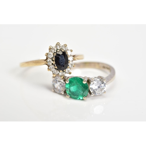 147 - TWO RINGS, the first a cluster ring set with an oval cut sapphire and colourless circular cut gemsto... 