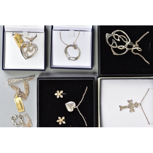 157 - A SELECTION OF NECKLACES, to include ten necklaces with various pendants such as a Celtic cross, hea... 