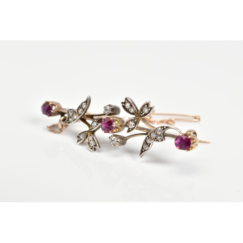 2 - A GOLD EARLY 20TH CENTURY RUBY AND DIAMOND FLORAL BAR BROOCH, three oval and round cut rubies measur... 