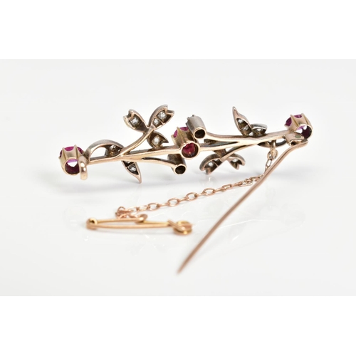 2 - A GOLD EARLY 20TH CENTURY RUBY AND DIAMOND FLORAL BAR BROOCH, three oval and round cut rubies measur... 