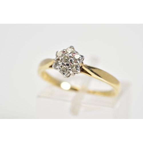 22 - A 9CT GOLD DIAMOND RING, designed as a cluster of round brilliant cut diamonds, to the tapered shoul... 