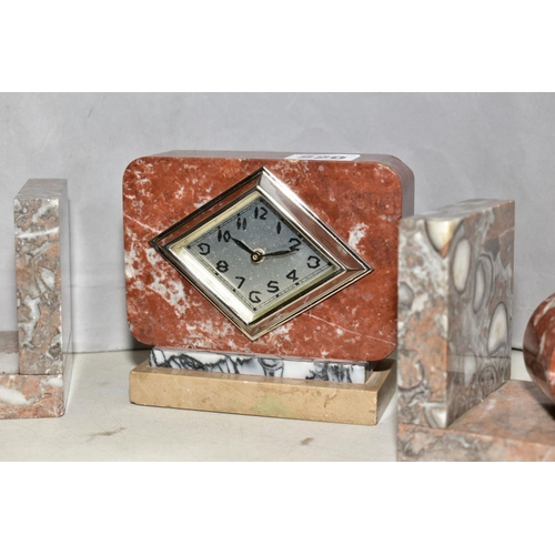 220 - A FRENCH ART DECO ROUGE AND VARIGATED MARBLE DESK CLOCK, with near matching marble book ends