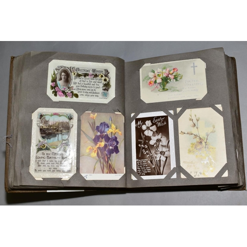 231 - A LARGE COLLECTION OF OVER FOUR HUNDRED AND SIXTY 'GREETINGS' TYPE POSTCARDS in a vintage album, the... 