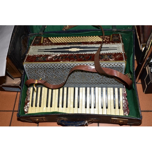 254 - A CARSINI ACCORDIAN, having one hundred and twenty bass keys and forty one treble keys, marble effec... 