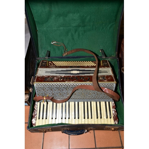 254 - A CARSINI ACCORDIAN, having one hundred and twenty bass keys and forty one treble keys, marble effec... 