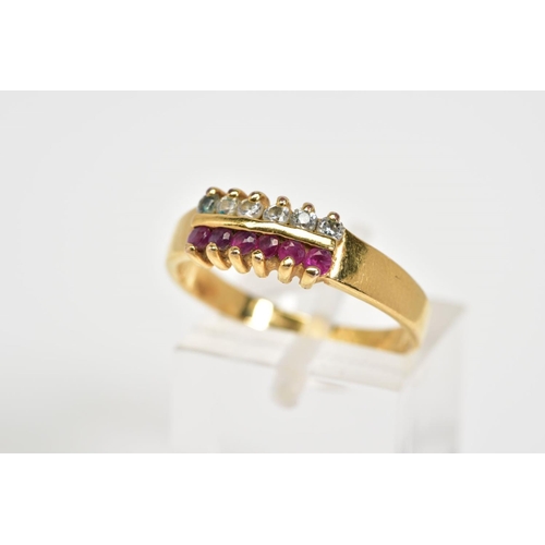 31 - A RING, designed with a double row, the first row of six circular cut rubies alongside a row of circ... 