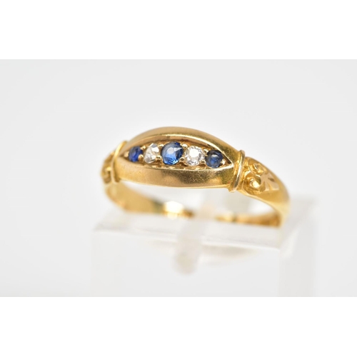 33 - AN EARLY 20TH CENTURY FIVE STONE RING, set with three circular cut sapphires interspaced by two sing... 