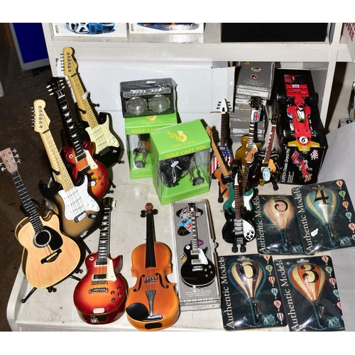 349 - DECORATIVE NOVELTY ITEMS to include musical instrument money boxes, Country Artists Speed Freak car ... 