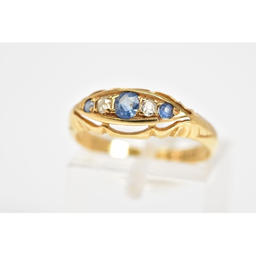 36 - AN EARLY 20TH CENTURY FIVE STONE RING, set with three circular cut sapphires interspaced by one sing... 