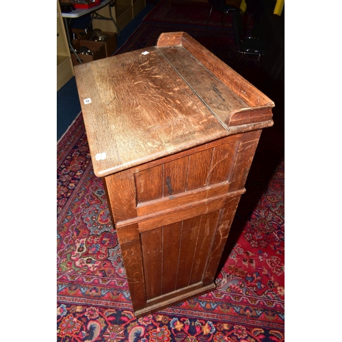 37 - A LATE 19TH CENTURY OAK LECTURN, raised back, sloped top, tongue and groove panelled sides, single s... 