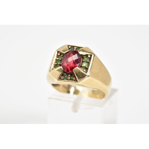 40 - A 9CT GOLD GENTLEMANS SIGNET RING, of square design set with a central oval cut garnet and green sto... 