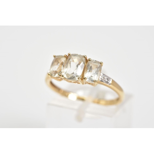 41 - A 9CT GOLD THREE STONE RING, set with three cushion cut colourless stones assessed as goshenite, wit... 