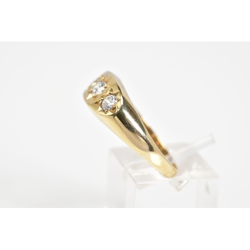 43 - A 9CT GOLD THREE STONE GYPSY RING, set with three round cut cubic zirconia stones, to a plain polish... 