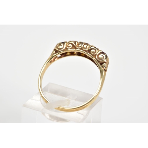 45 - A 9CT GOLD RING, designed as a row of three circular cut garnets interspaced by two circular opals a... 