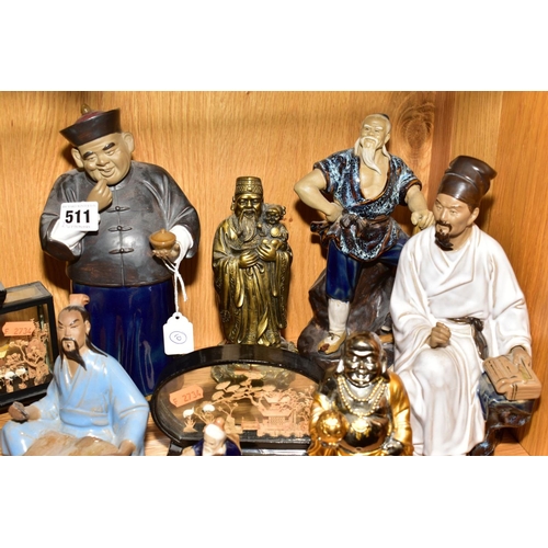 511 - A GROUP OF JAPANESE CERAMIC FIGURES, including two seated scholars, a seated scribe, man with axe, m... 