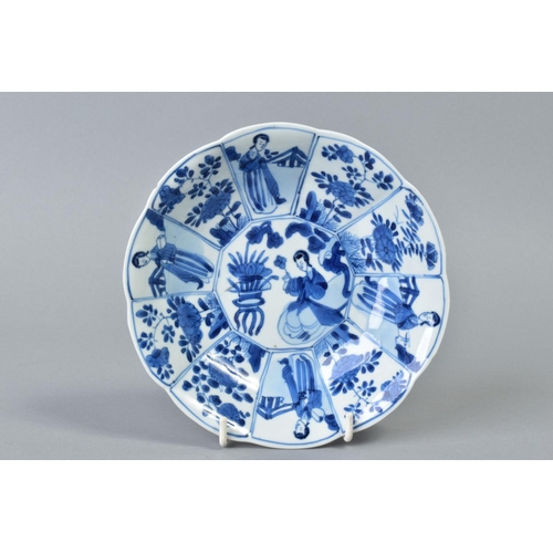 62 - A CHINESE KANGXI BLUE AND WHITE PORCELAIN BOWL, of ten petal outline, decorated with female attendan... 