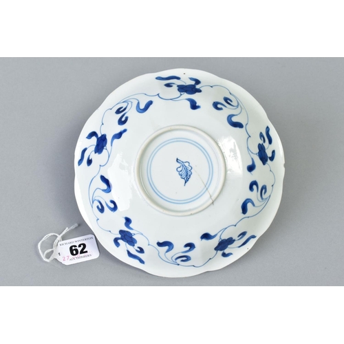 62 - A CHINESE KANGXI BLUE AND WHITE PORCELAIN BOWL, of ten petal outline, decorated with female attendan... 