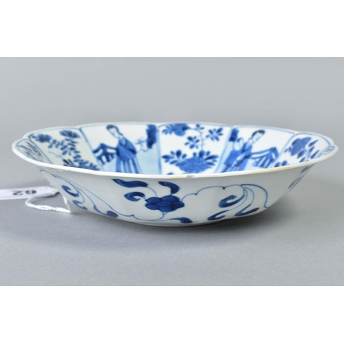 62 - A CHINESE KANGXI BLUE AND WHITE PORCELAIN BOWL, of ten petal outline, decorated with female attendan... 