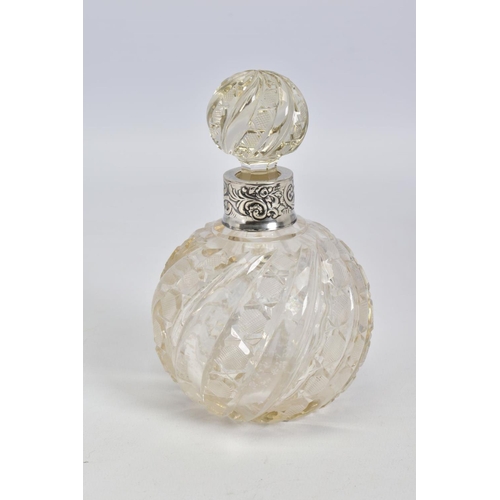 64 - A LATE VICTORIAN SILVER MOUNTED CLEAR GLASS SCENT BOTTLE, with moulded swirl and hobnail cut decorat... 