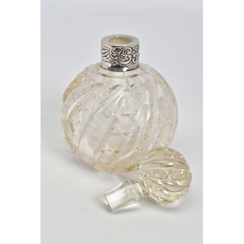 64 - A LATE VICTORIAN SILVER MOUNTED CLEAR GLASS SCENT BOTTLE, with moulded swirl and hobnail cut decorat... 