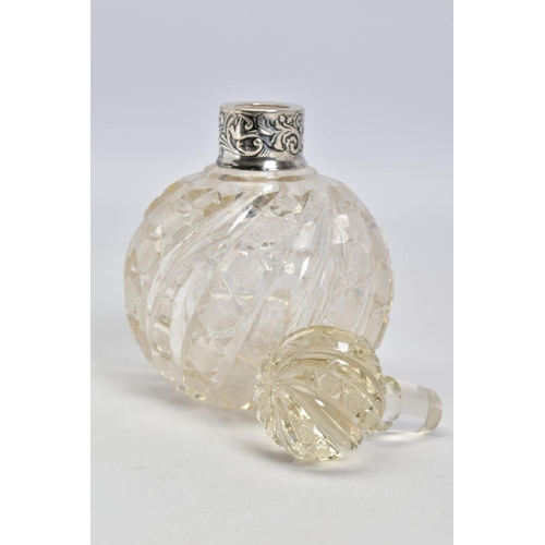 64 - A LATE VICTORIAN SILVER MOUNTED CLEAR GLASS SCENT BOTTLE, with moulded swirl and hobnail cut decorat... 