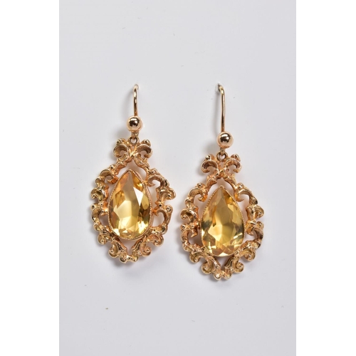 73 - A PAIR OF DROP EARRINGS, each designed with a pear cut citrine within a filigree surround, to the fi... 