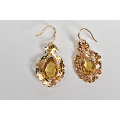 73 - A PAIR OF DROP EARRINGS, each designed with a pear cut citrine within a filigree surround, to the fi... 