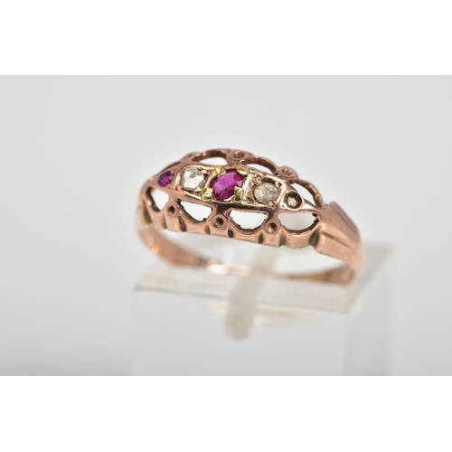 74 - A 9CT GOLD FIVE STONE RING, designed with circular cut rubies interspaced by one single cut and one ... 