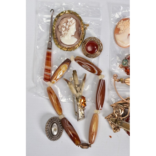 91 - A SELECTION OF ITEMS, to include a lucky grouse foot brooch set with an oval orange paste a top a St... 