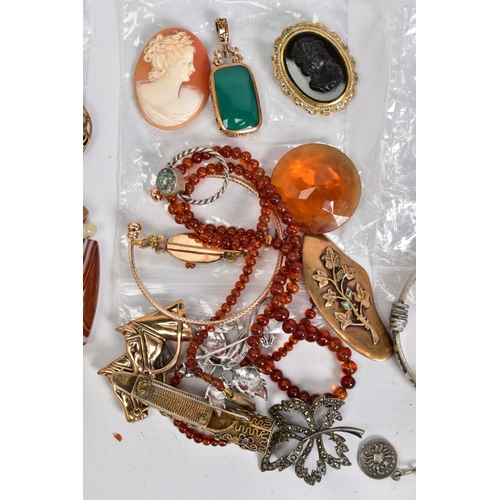 91 - A SELECTION OF ITEMS, to include a lucky grouse foot brooch set with an oval orange paste a top a St... 