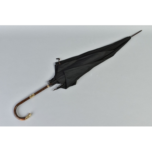 227A - A LATE VICTORIAN BLACK SILK UMBRELLA, the cane handle with a 18ct gold plated mounts, length 89cm