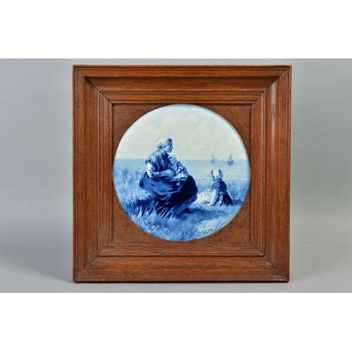 228A - AN EARLY 20TH CENTURY CIRCULAR DELFT PLAQUE IN AN OAK FRAME, the plaque signed 'Near Artz' painted w... 