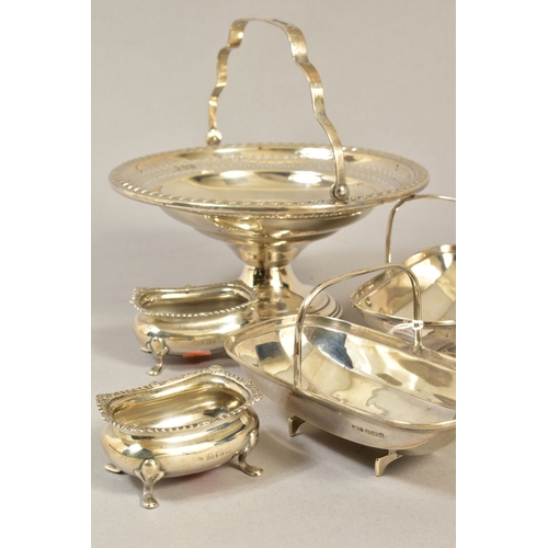 101 - A PAIR OF EDWARDIAN SILVER GARDEN TRUG SHAPED BON BON DISHES, fixed handles, reg no 545848 and Z1816... 