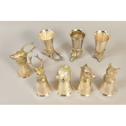 104 - A MATCHED SET OF EIGHT SILVER PLATE/PEWTER STIRRUP CUPS, cast with animal mask or bird finials, incl... 