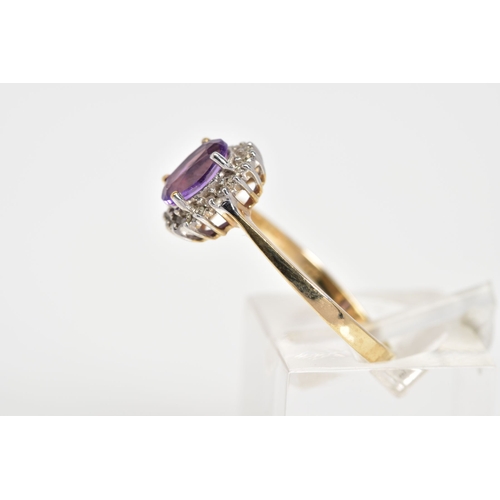 15 - A 9CT GOLD CLUSTER RING, designed with a central oval cut amethyst and single cut diamond surround, ... 