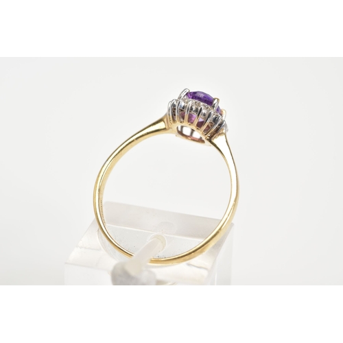 15 - A 9CT GOLD CLUSTER RING, designed with a central oval cut amethyst and single cut diamond surround, ... 