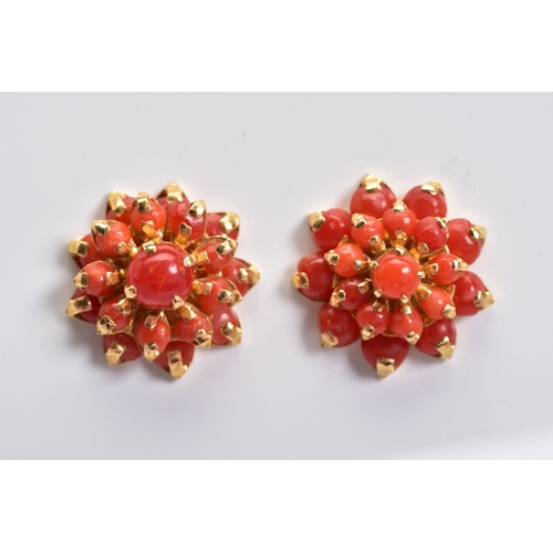 24 - A PAIR OF CORAL EAR STUDS, a round cluster measuring approximately 16.6mm in diameter, screw post fi... 